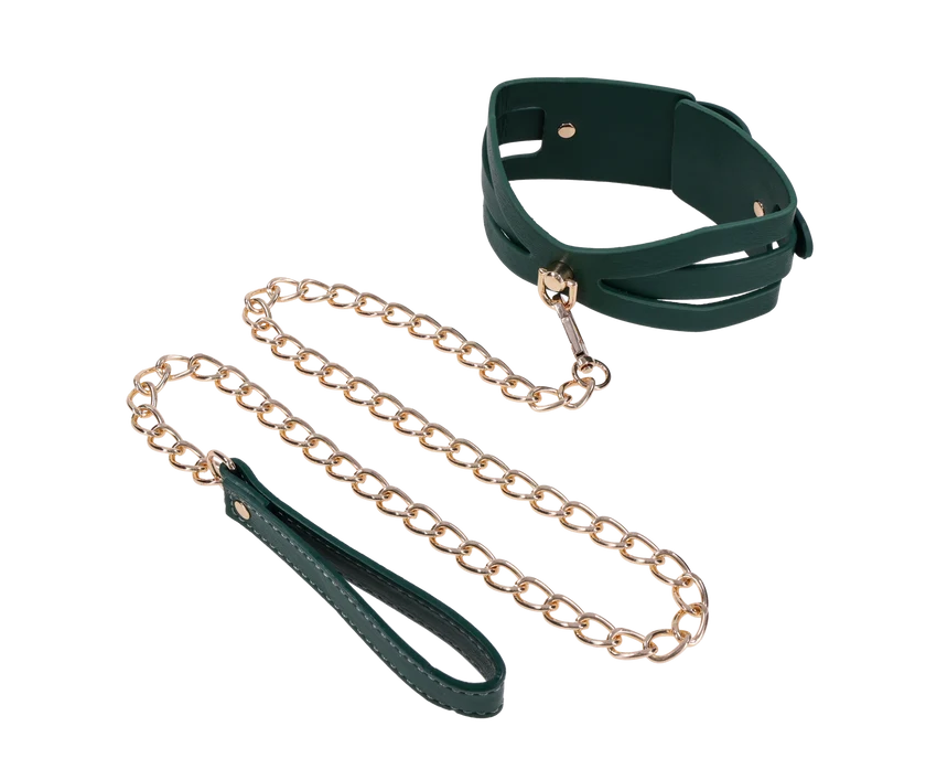 Emerald green faux leather collar with cutout detailing and a gold chain leash