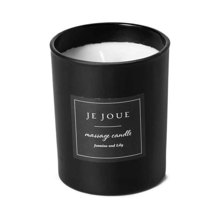 Je Joue massage candle in a glass vessel with its patterned gift box