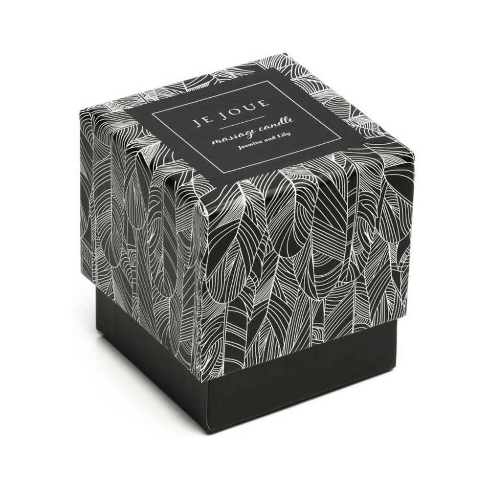Je Joue massage candle in a glass vessel with its patterned gift box
