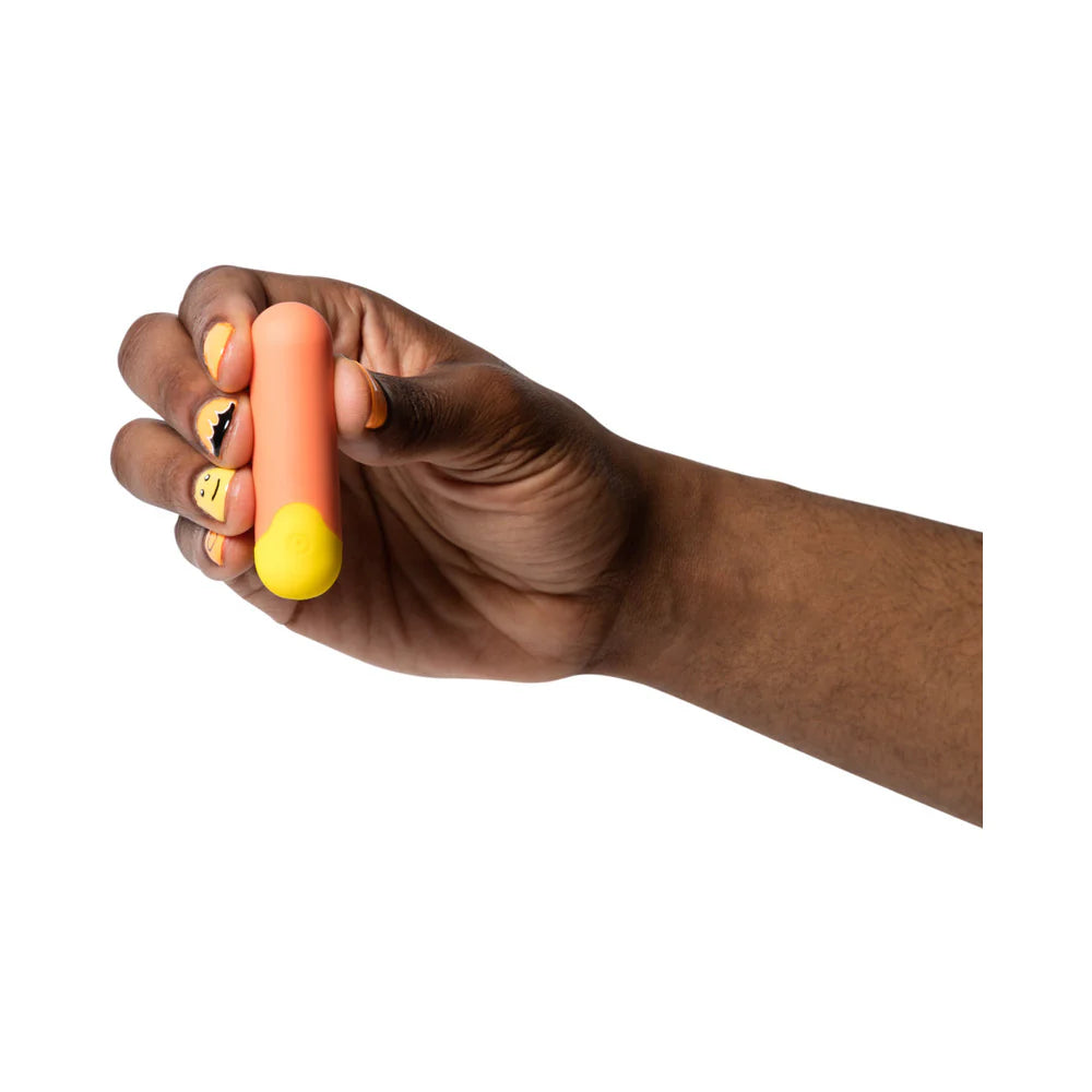 ROMP Riot bullet vibrator held in hand for size reference