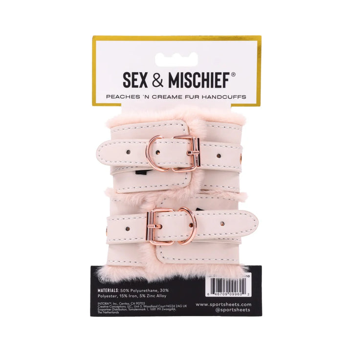 Pale peach faux leather handcuffs lined in soft faux fur, joined by a rose gold chain