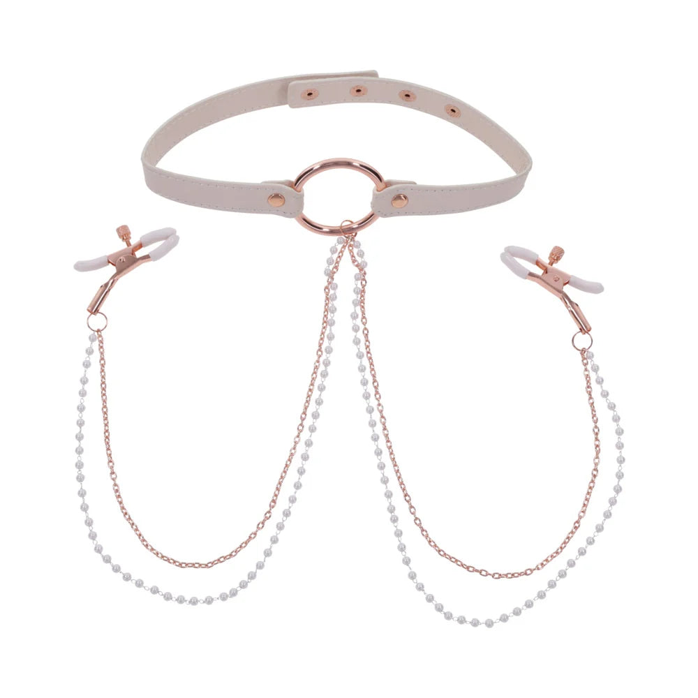 Pale peach faux leather collar with rose gold hardware and pearl chains running to two nipple clamps