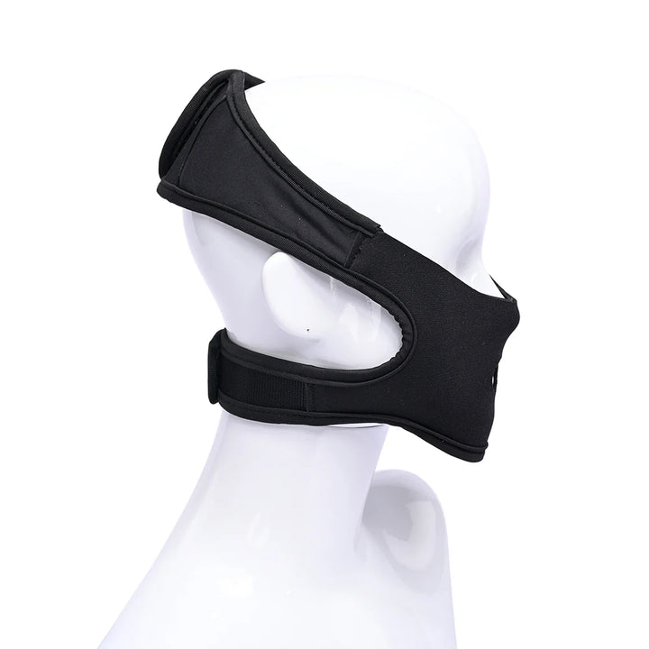 Black neoprene head harness with hook and loop straps, worn over the mouth for face-sitting play