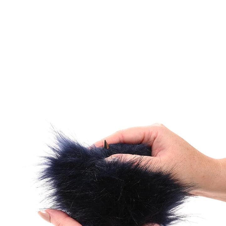 Royal blue faux fur mitt with gold spikes concealed on one side