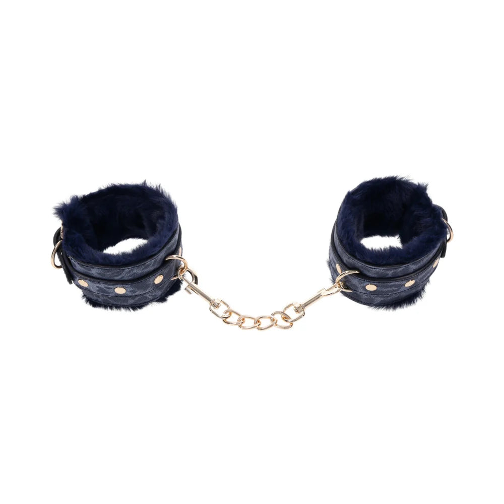 Blue animal print faux leather handcuffs lined in blue faux fur with gold hardware and chain
