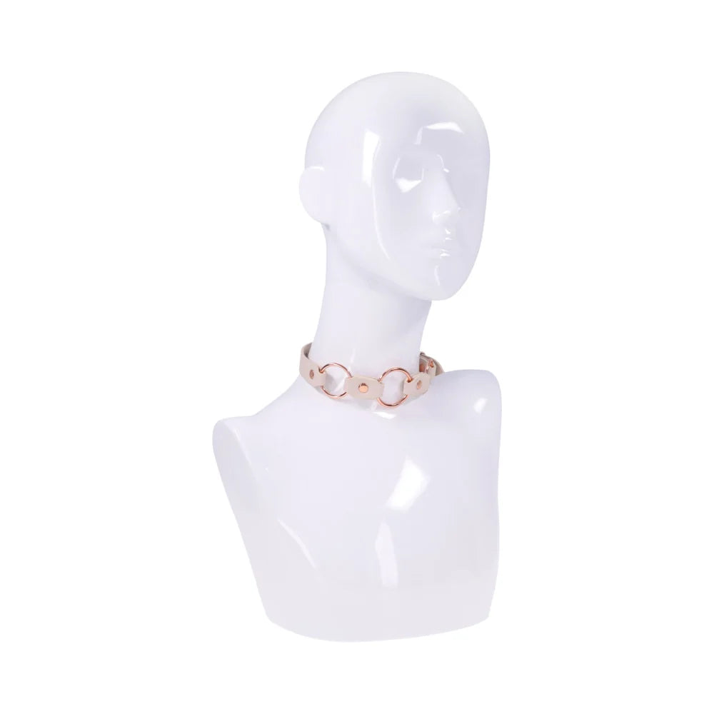 Smooth peach faux leather day collar with three rose gold rings across the front