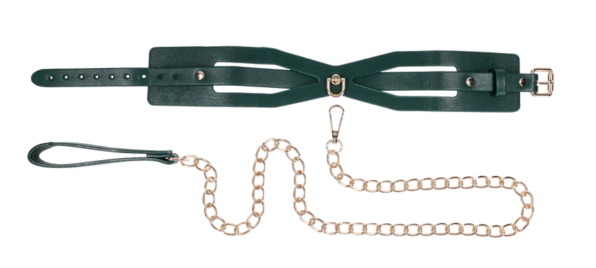 Emerald green faux leather collar with cutout detailing and a gold chain leash