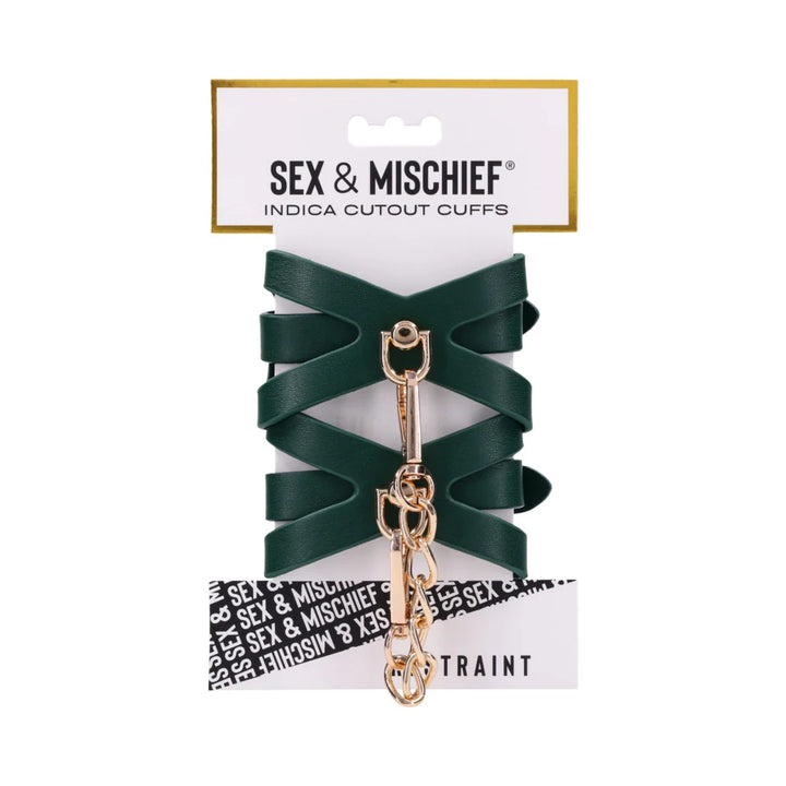Emerald green faux leather wrist cuffs with cutout detailing and gold chain hardware