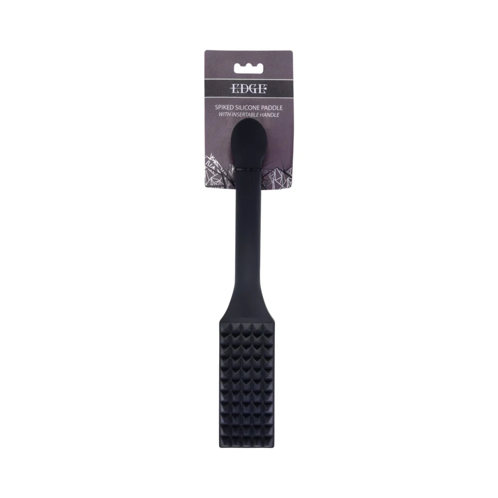 Black silicone paddle with rows of raised spikes across the head and a long reinforced handle