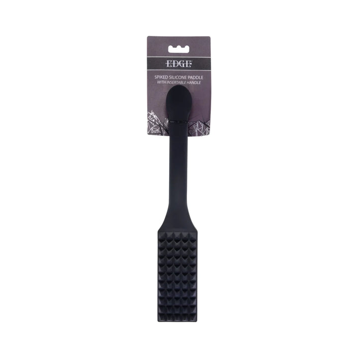 Black silicone paddle with rows of raised spikes across the head and a long reinforced handle