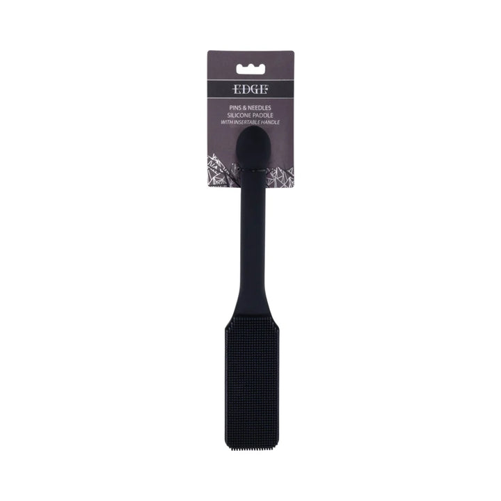 Black silicone paddle with a head covered in fine needle-like bristles and a long handle