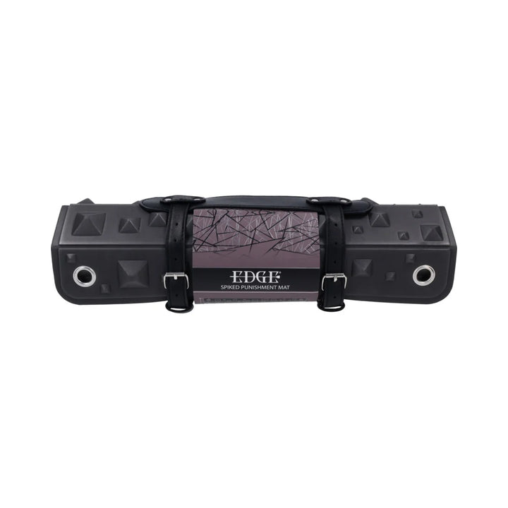 Black foam mat covered in pyramid spikes, shown rolled into its buckled faux leather holster