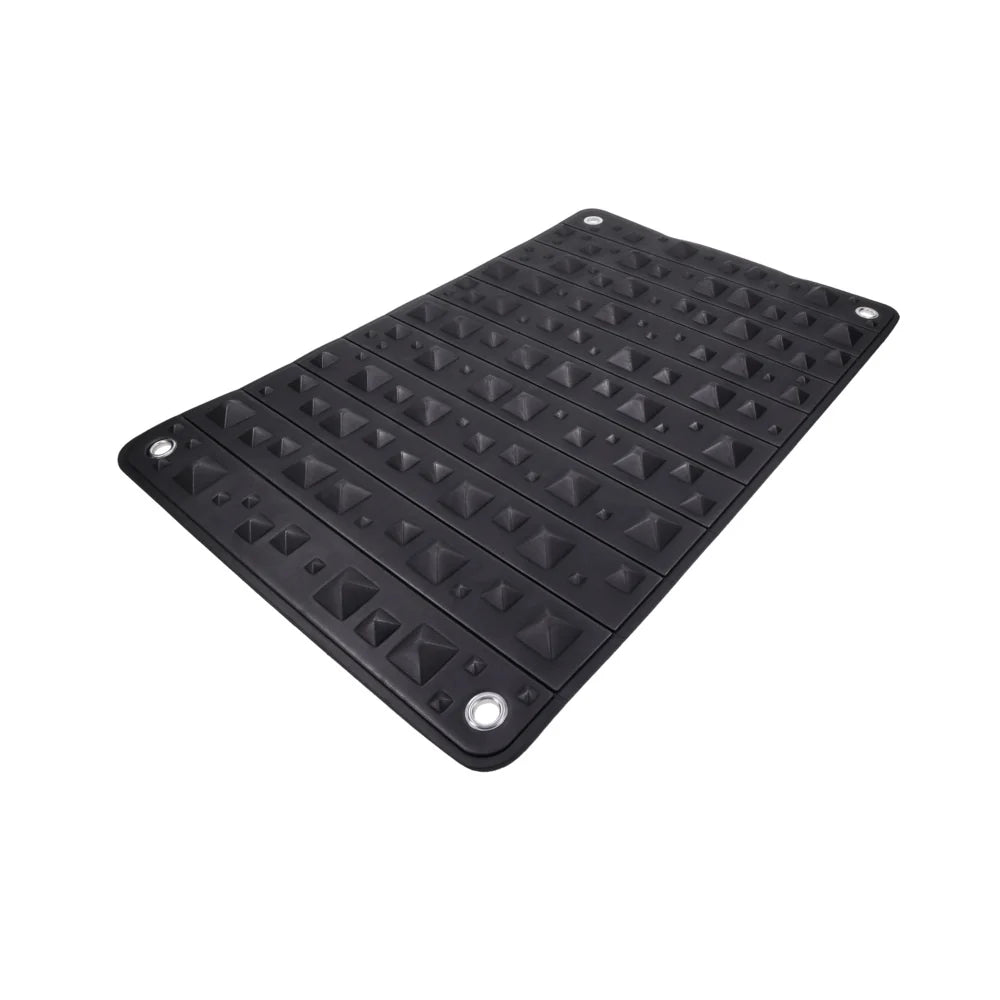 Black foam mat covered in pyramid spikes, shown rolled into its buckled faux leather holster