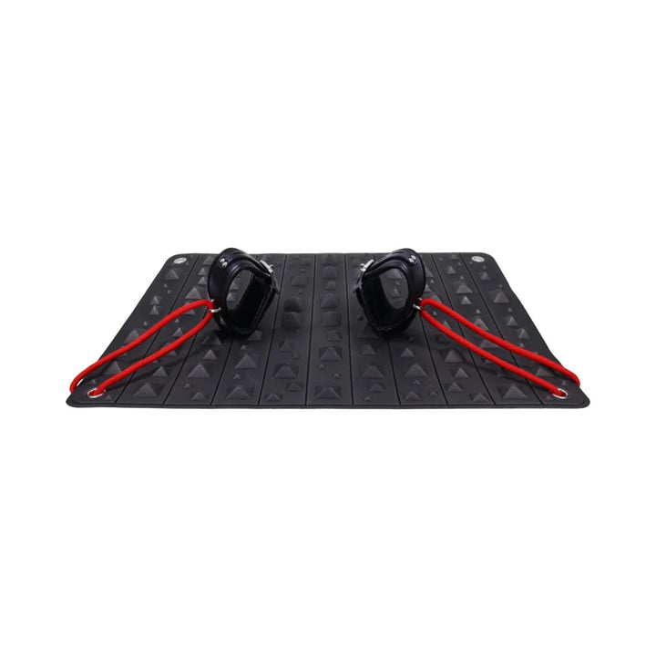 Black foam mat covered in pyramid spikes, shown rolled into its buckled faux leather holster