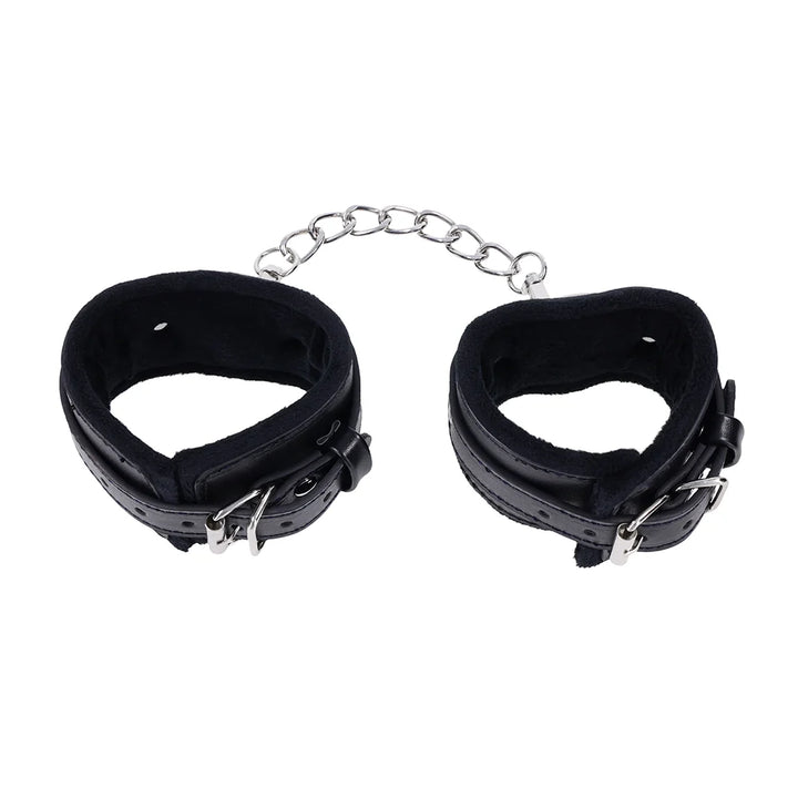 Black faux leather cuffs with silver O-ring connectors and a removable chain with gate clips
