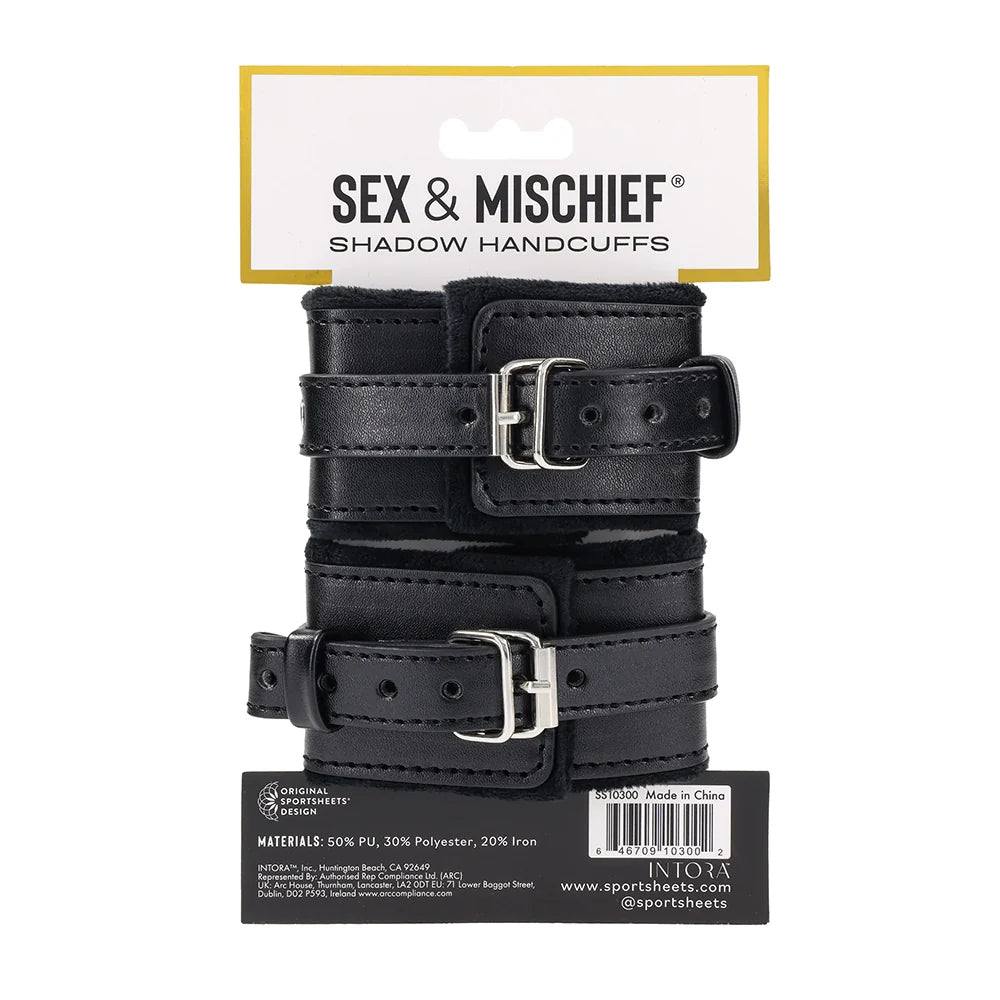 Black faux leather cuffs with silver O-ring connectors and a removable chain with gate clips