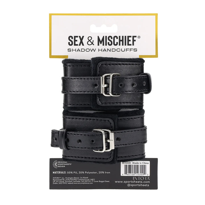 Black faux leather cuffs with silver O-ring connectors and a removable chain with gate clips
