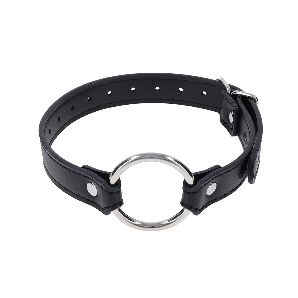 Black faux leather strap with a silver O-ring, worn as a bracelet, cross cuffs, or a day collar
