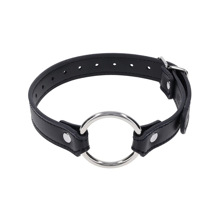 Black faux leather strap with a silver O-ring, worn as a bracelet, cross cuffs, or a day collar