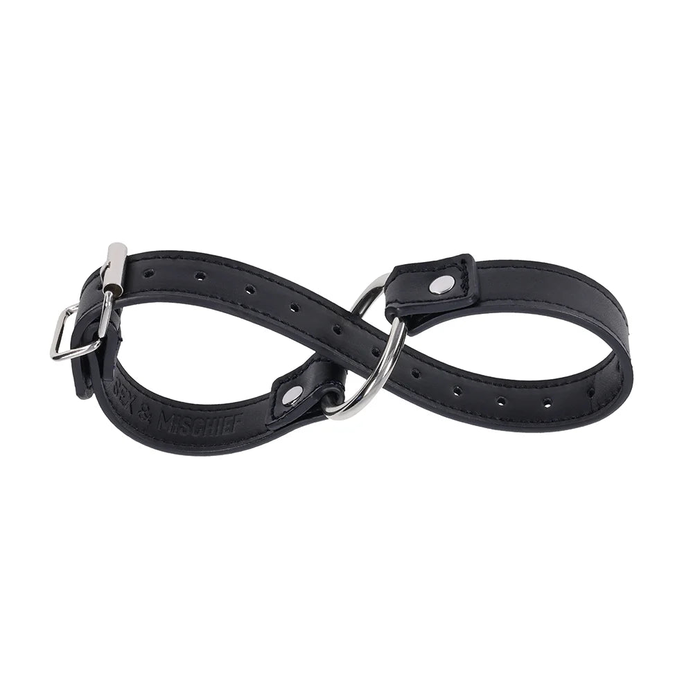 Black faux leather strap with a silver O-ring, worn as a bracelet, cross cuffs, or a day collar