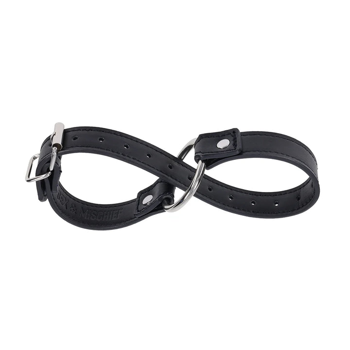 Black faux leather strap with a silver O-ring, worn as a bracelet, cross cuffs, or a day collar