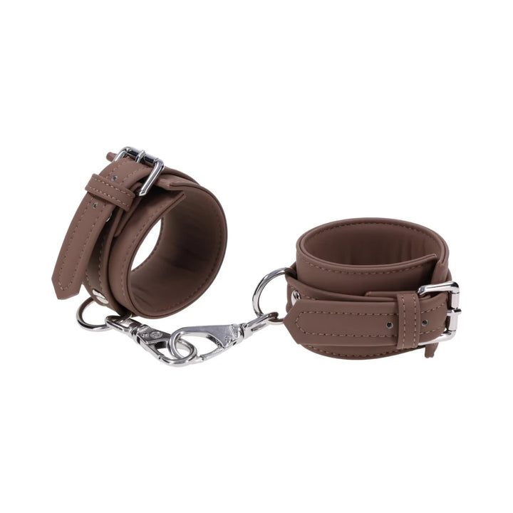 Dawn Dream: Mocha brown cashmere-touch silicone wrist cuffs with silver buckles and gate clips joined by a short chain