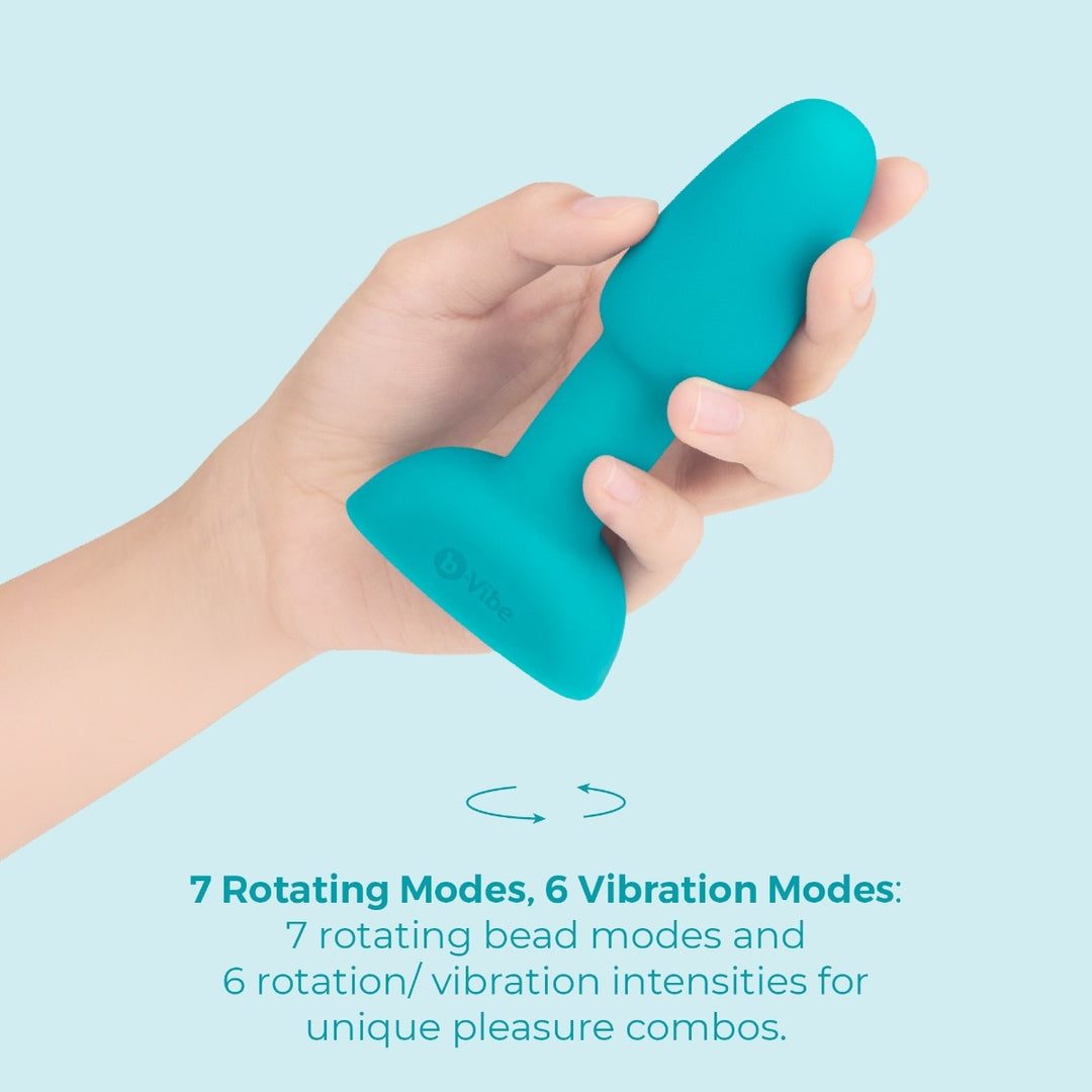 b-Vibe Rimming Petite in Teal held in hand for size reference
